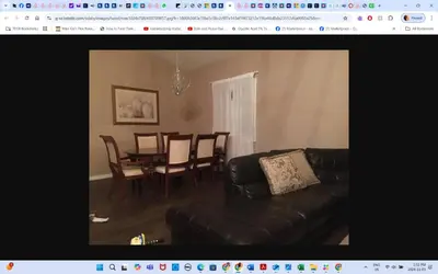 a living room with a couch and a dining room table at Room # 2 sleep 4 Arrangement in Edmonton