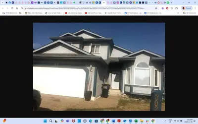 a picture of a house with a garage at Room # 3 Sleep 4 Arrangement in Edmonton