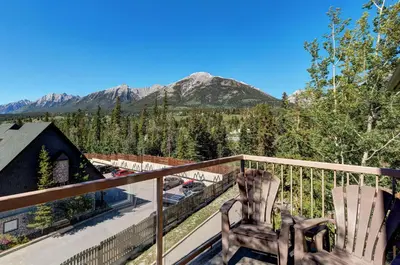 a balcony with a view of a mountain at Cozy Condo with Epic Mountain Views, Parking, Air Con in Canmore