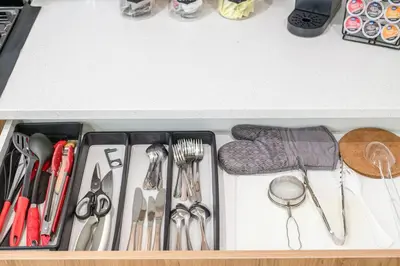 a drawer filled with utensils in a kitchen at Luxury Family Home - Sleeps 10 - King Bed in Nisku