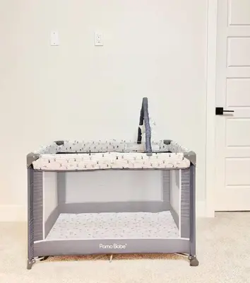 a toy shelf in a room next to a door at Luxury Family Home - Sleeps 10 - King Bed in Nisku