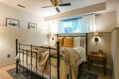 a bedroom with a bed and a ceiling fan at The Reef guest suite in Sechelt