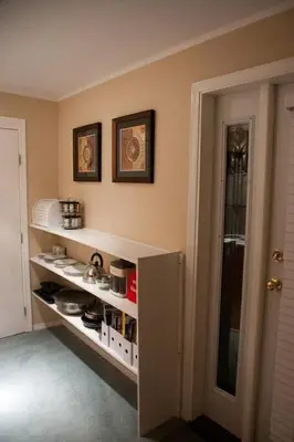 a kitchen with a shelf with food on it at Oceanview Guest Suite with Large 2 Person Soaker Tub in Nanoose Bay