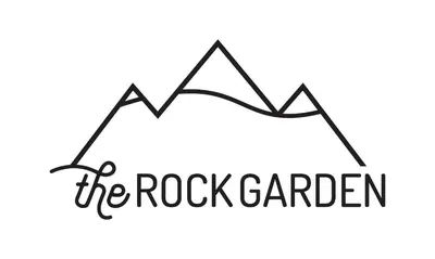 a logo for the rock garden at Elevated Mountain Living 2BD Spring Creek Unit in Canmore