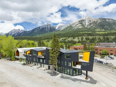 a rendering of a house with mountains in the background at Scenic Views in a Luxurious Townhouse in Canmore