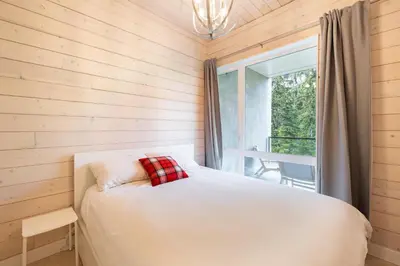 a bedroom with a bed and a window at #9111 Wedgewoods in Whistler