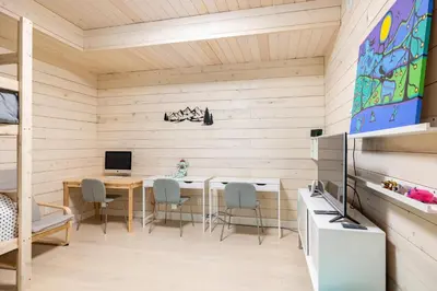 a kitchen with a table and chairs in a room at #9111 Wedgewoods in Whistler