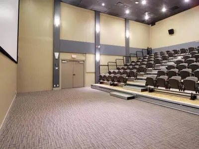 a room with rows of chairs in a gym at Classic Hideaway Elegant 2BD 2BTH in Canmore