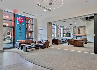 a lobby with couches and chairs in a building at Quiet Retreat for Couples in Canmore