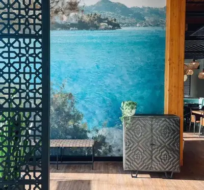 a wall with a large painting of the ocean at Trendy Glenora , Sleeps 10 , Downtown & River Valley adjacent , Jacuzzi tub! in Edmonton