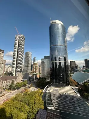 a tall glass building in a city with tall buildings at City Retreat With Views in the Heart of Downtown in Vancouver
