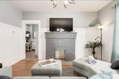 a living room with a couch and a fireplace at Ceruleans 3BR Suite in Calgary in Calgary