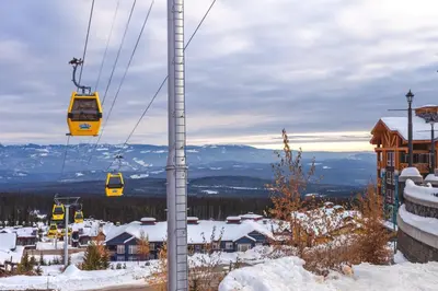 a ski lift in a ski resort in the snow at The Lifty Ski-In Ski-Out Studio, Pool and Gym in Big White