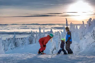a group of people on skis in the snow at The Dorm Ski-In Ski-Out Studio, Pool and Gym in Big White