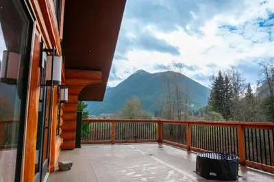 a balcony with a view of a mountain at Douglas Fir Retreat, Mtn Views and Expansive Deck in Sunshine Valley