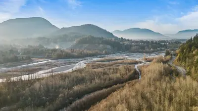 an aerial view of a river in a valley with mountains at EmeraldRidge Retreat - 180 Degree Amazing View & Firepit & BBQ in Chilliwack