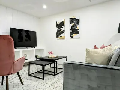 a living room with a couch and a table at A Slice of Heaven in Chestermere in Calgary