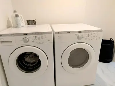 two washing machines are next to each other at A Slice of Heaven in Chestermere in Calgary