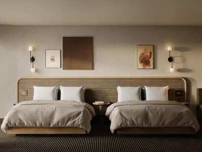 a hotel room with two beds with white pillows at The Kenrick Hotel in Banff