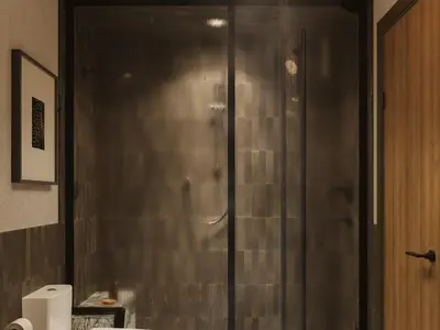 a shower with a glass door in a bathroom at The Kenrick Hotel in Banff