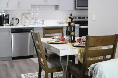 a kitchen with a table with plates of food on it at Lovely 2Bd 1Bth suite Free pking separated HVAC in Calgary