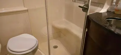 a bathroom with a toilet and a shower and a sink at Fly Knots in Vancouver