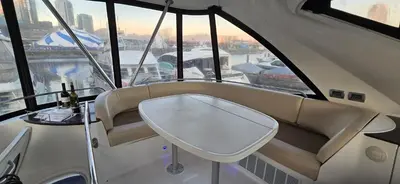 a boat seat with a table in front of a window at Fly Knots in Vancouver