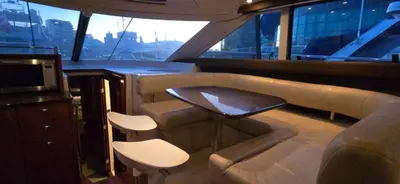 a bar on a boat with a table and chairs at Fly Knots in Vancouver