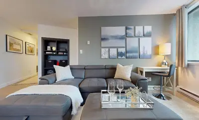 a living room with a couch and a table at Whistler village central stay! in Whistler