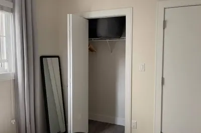 a mirror in a closet next to a mirror at Modern Spacious 1BR minutes away from Main St in Vancouver