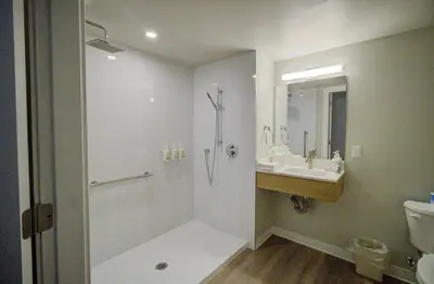 a bathroom with a shower and a sink at Baymont by Wyndham Gold River in Gold River