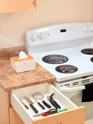 a kitchen with a white stove top oven at Modern & Cozy 2-Bed Suite in Vancouver in Vancouver