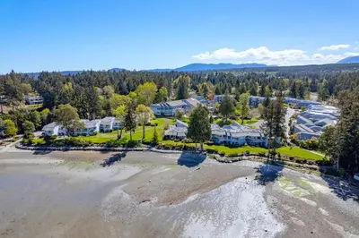 an aerial view of a resort with a beach at Beachside Townhouses at The Pacific Shores Strata Property in Nanoose Bay