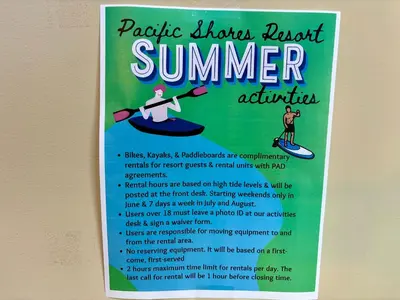 a poster for a summer event with a person on a surfboard at Beachside Townhouses at The Pacific Shores Strata Property in Nanoose Bay