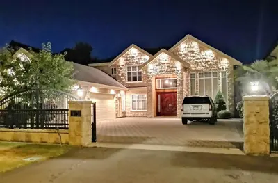 a house with a car parked in front of it at Close to YVR King Sized Private Entrance Suite in Richmond