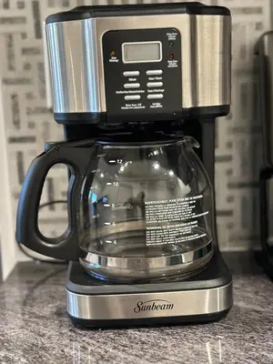 a coffee maker sitting on top of a counter at Juanus Cozy Cove in Edmonton