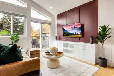 a living room with a couch and a table at Perfect for Long Stays Free Parking Pets Allowed in Calgary