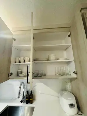 a kitchen with a sink and a counter top with a sink at Comfy Neutral Living Free Parking in Calgary