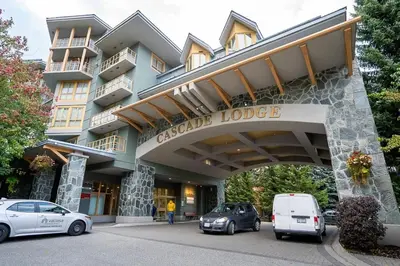 a building with cars parked in front of it at KING Bed STUDIO in the Village in Whistler