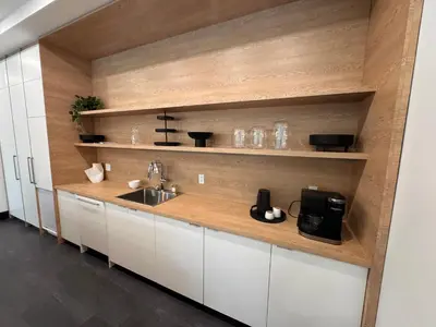a kitchen with white cabinets and a sink at RED Mountain Gem in Trail