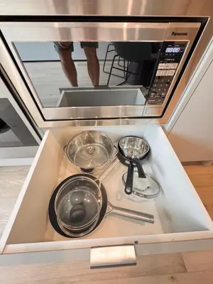 a stove top with three pots and pans on it at Premium RED Mountain Lodging in Trail