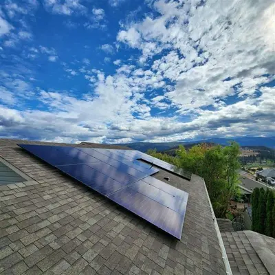 a solar panel on the roof of a house at Licensed 2-Bedroom Suite Eco-Friendly Solar Home in Kelowna