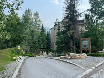 a road in front of a building with a sign at Toby Creek Lodge by StayIn in Panorama