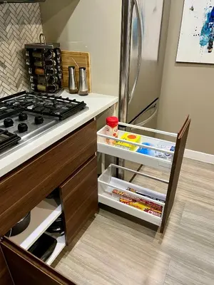 a kitchen with a stove and a refrigerator at Century Park Condo Oasis in Edmonton