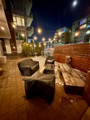 a group of sleeping bags sitting on top of a bench at Century Park Condo Oasis in Edmonton