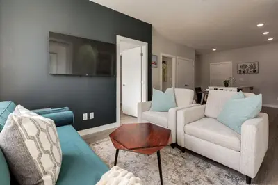 a living room with two chairs and a couch at Free Parking, Close to Downtown, Pet Friendly in Calgary