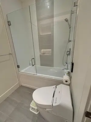 a bathroom with a white toilet and a shower at Cozy&Private Suite in Vancouver in Vancouver