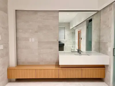 a bathroom with a sink and a mirror at Cozy&Private Suite in Vancouver in Vancouver