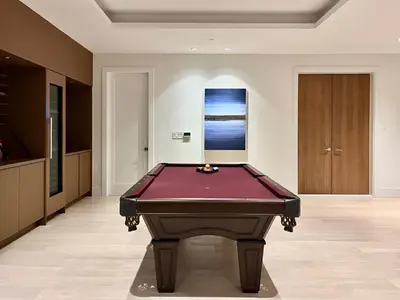 a pool table in the middle of a room at Cozy&Private Suite in Vancouver in Vancouver