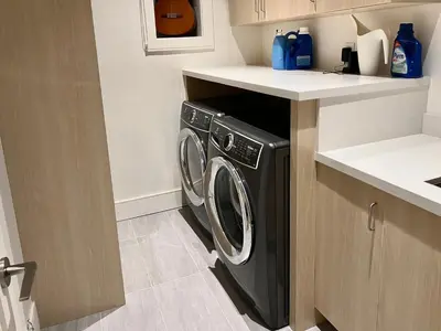 a black washer and dryer in a kitchen at Cozy&Private Suite in Vancouver in Vancouver